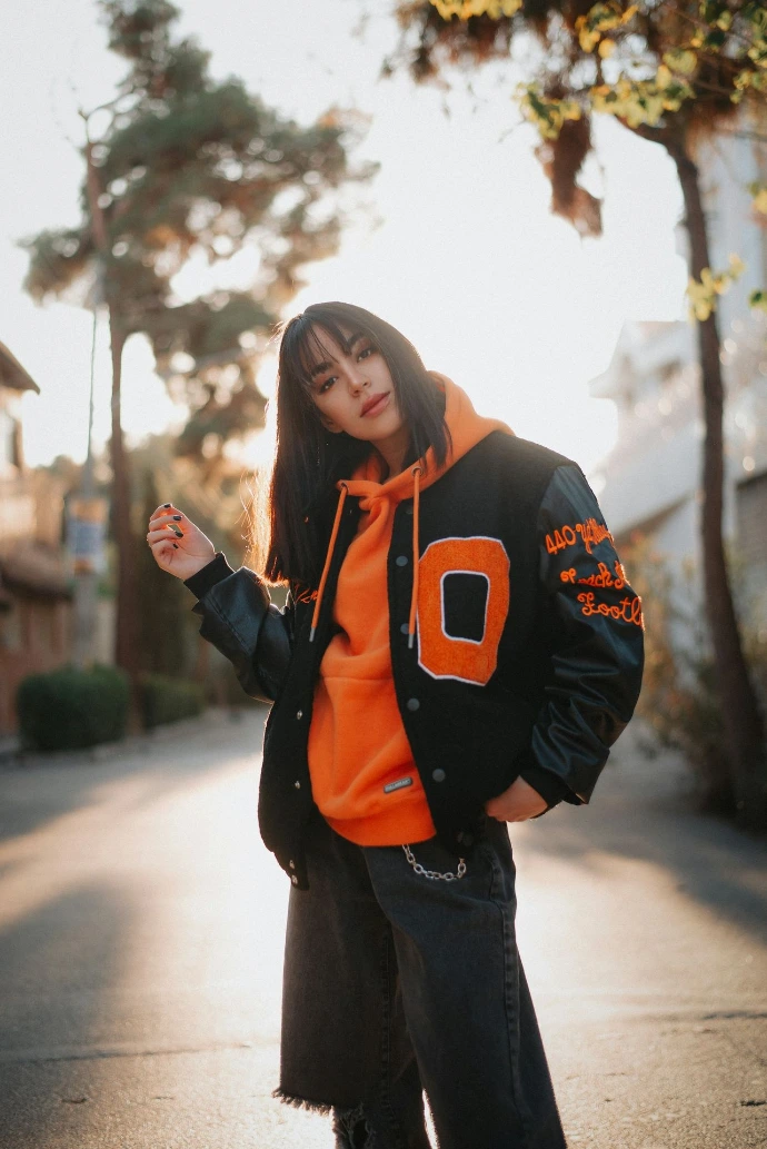 a woman in an orange jacket